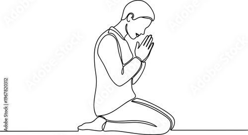 Man in prayer with hands together.