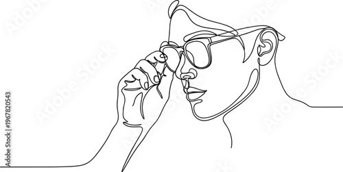 Woman putting on her glasses.