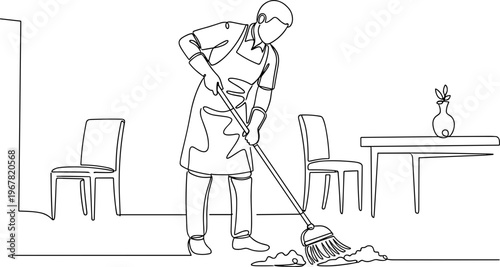 Woman cleaning with a broom indoors.