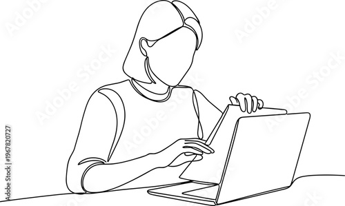 Woman working on laptop computer.