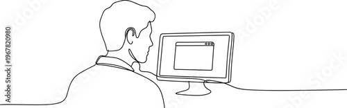 Man sitting at computer desk.