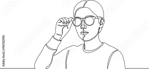 Young man wearing glasses and cap.