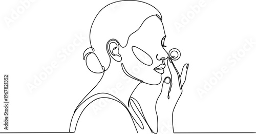 Woman Applying Cosmetic Product to Face.
