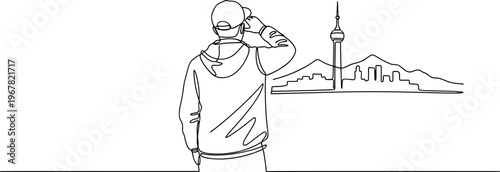 Man Looking Out Over Cityscape Alone.