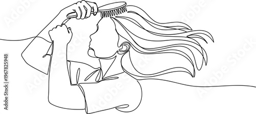 Woman brushing her long flowing hair.