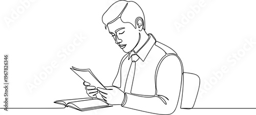 Man sitting and using a tablet.