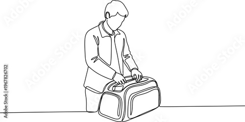 Man packing travel luggage bag.