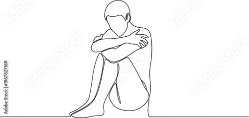 A person sitting alone depressed.
