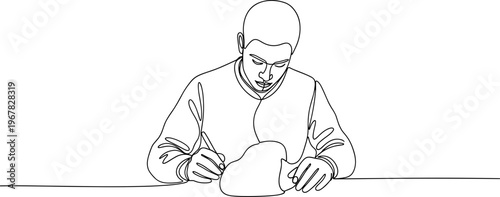 Man sitting at table with food.