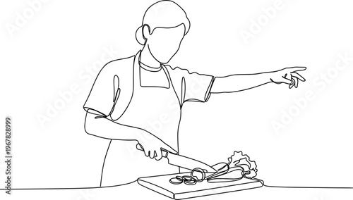 Man wearing apron cutting meat.