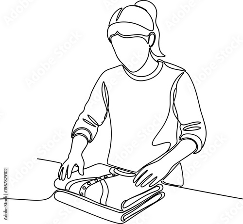 Woman ironing a shirt on table.
