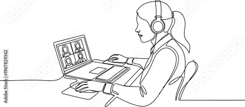 Woman wearing headset using laptop computer.