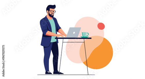 Modern professional man with glasses and a beard focused on working on his laptop while standing at a contemporary desk.