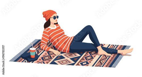 Relaxed girl lying on a patterned picnic rug with a drink in her hand enjoying her leisure time on a plain white background.