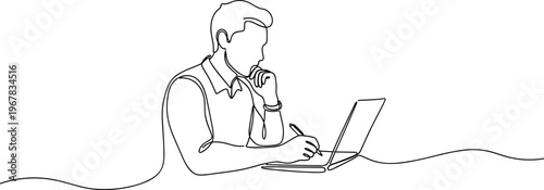 Man working on laptop computer.