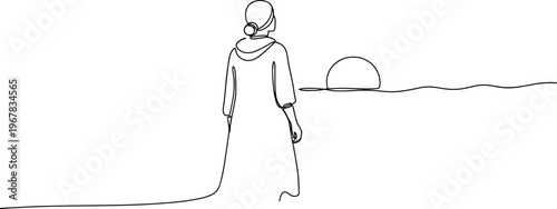 Person Wearing Long Robe Walking Alone.