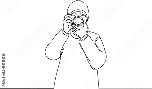 Person holding camera and taking photo.