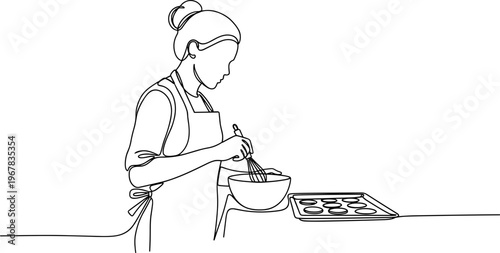 Woman wearing apron preparing food.