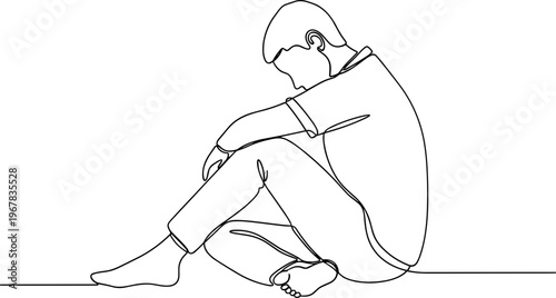 Sad man sitting on the floor.