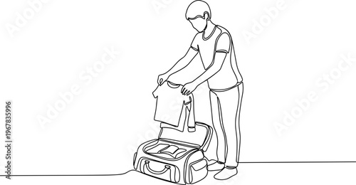 Man putting laundry in washing machine.