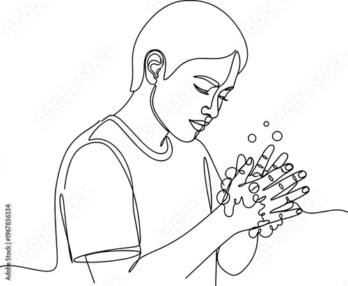 Boy washing hands with soap bubbles.