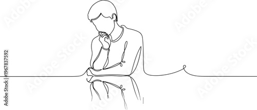 Man sitting with hand on chin.