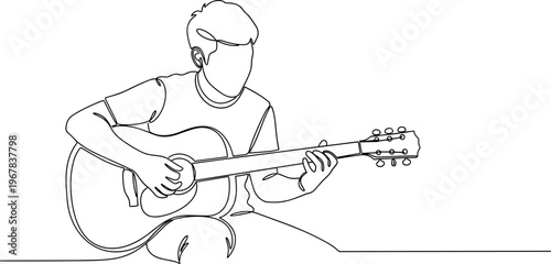 Man playing acoustic guitar sitting down.