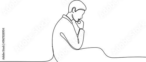 Man thinking with hand on face.