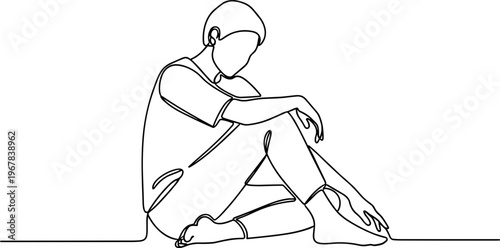 A person sitting alone on floor.