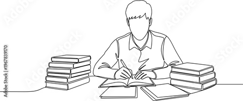 Man sitting at desk with books.