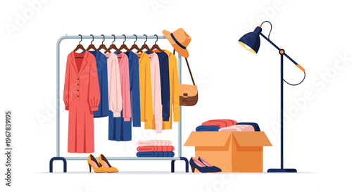 Fashionable clothes on a metal rack next to a storage box full of garments and a floor lamp in a clean and modern room interior.