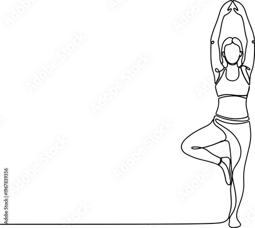 Woman in yoga tree pose standing.