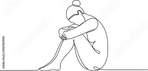 Sad woman sitting alone depressed.