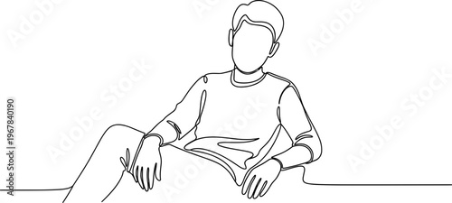 Man sitting and reading a book.