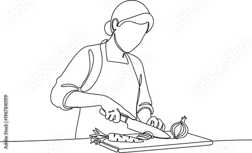 Woman cutting food on a board.