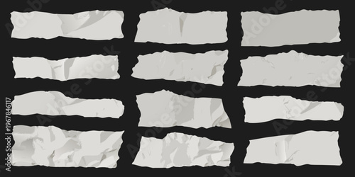 Collection of torn paper pieces arranged on a black background