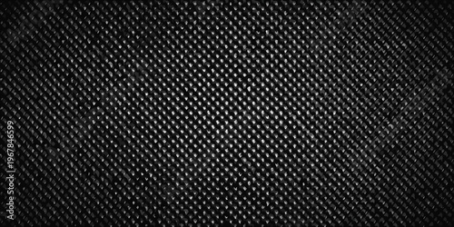 Close up of a dark textured fabric with a repeating diamond pattern