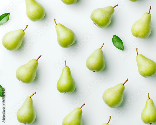 Fresh green pears arranged on white background create vibrant and appealing display, perfect for showcasing natural beauty