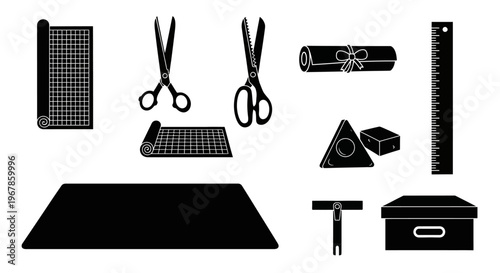 A collection of crafting and art supplies including scissors, a ruler, cutting mat, and a box for storage