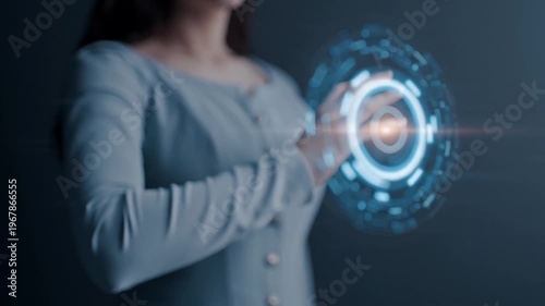 Woman interacting with futuristic technology.