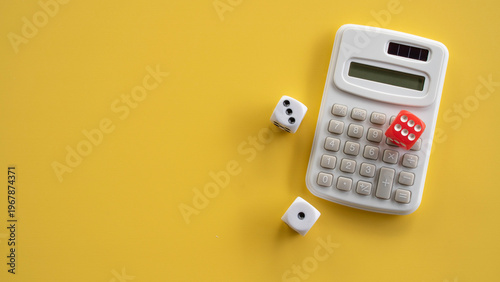 Red and White Dice Scattered Around White Electronic Calculator on Yellow Background