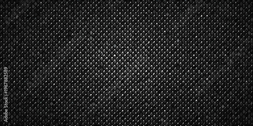 Close up of a dark textured diamond patterned metal or mesh surface
