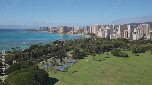 Waikiki Beach seen from above, park and tall buildings by the ocean coast, Honolulu city panorama	