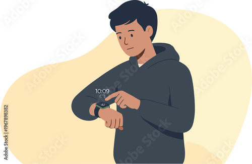 A young man checks his smartwatch on his wrist in an indoor setting.