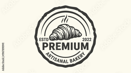 Elegant bakery logo featuring a delicious croissant and premium quality.