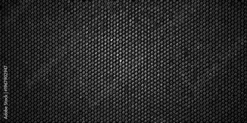 Close up of a dark textured surface resembling snake skin