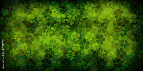 A vibrant background of overlapping four leaf clovers in shades of green