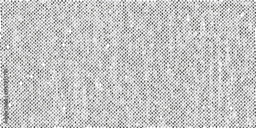 Close up of a textured speckled gray and white surface resembling fabric