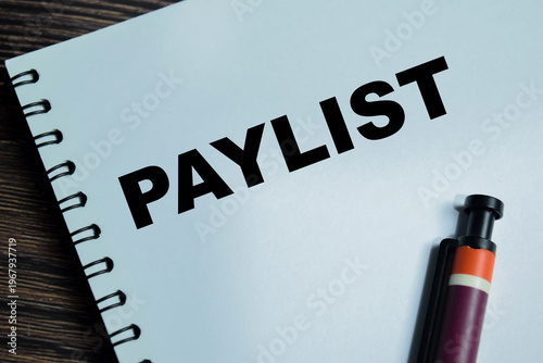 Slika na platnu Concept of paylist write on book isolated on Wooden Table