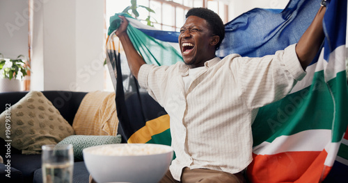 Canvas Print Black man, South African flag and celebration in home, soccer and cheering for champion